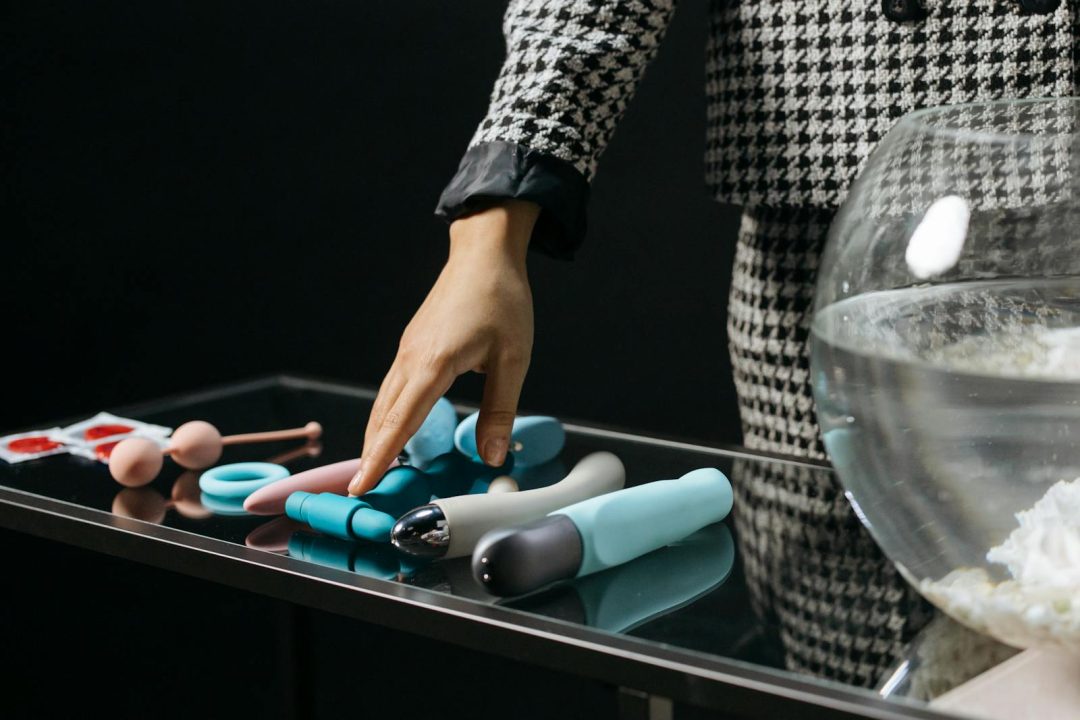 Sex Toys on a Glass Table